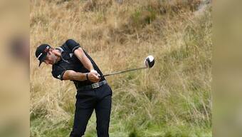 Golf: Stenson, Johnson share US Open lead; Tiger shoots 80