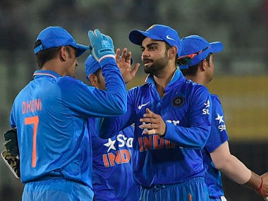 MS Dhoni (L) celebrates with his teammate Virat Kohli (2nd L) after winning the 3rd ODI. AFP