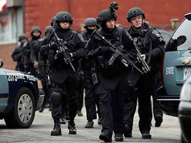 Boston Police conduct a search for a suspect in the Boston Marathon bombings,