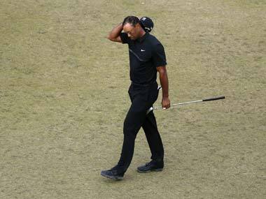 Tiger Woods walks off the 10th green. AP