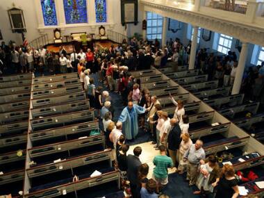 Charleston prays for the victims of the racial crime. AP