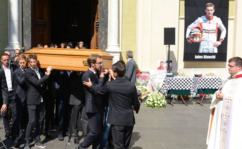 Formula One drivers Jean-Eric Vergne (front) and Romain Grosjean (3rdL), friends and relatives carry the coffin of late Marussia F1 driver Jules Bianchi during the funeral ceremony at the Sainte Reparate Cathedral in Nice, France, July 21, 2015. Bianchi, 25, died in hospital in Nice on Friday, nine months after his crash at Suzuka in Japan and without regaining consciousness. REUTERS