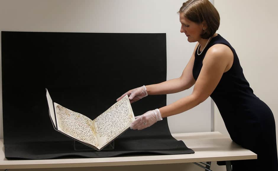 Conservator, Marie Sviergula holds a fragment of a Koran manuscript in the library at the University of Birmingham in Britain July 22, 2015. A British university said on Wednesday that fragments of a Koran manuscript found in its library were from one of the oldest surviving copies of the Islamic text in the world, possibly written by someone who might have known Prophet Mohammad. Radiocarbon dating indicated that the parchment folios held by the University of Birmingham in central England were at least 1,370 years old, which would make them one of the earliest written forms of the Islamic holy book in existence. REUTERS