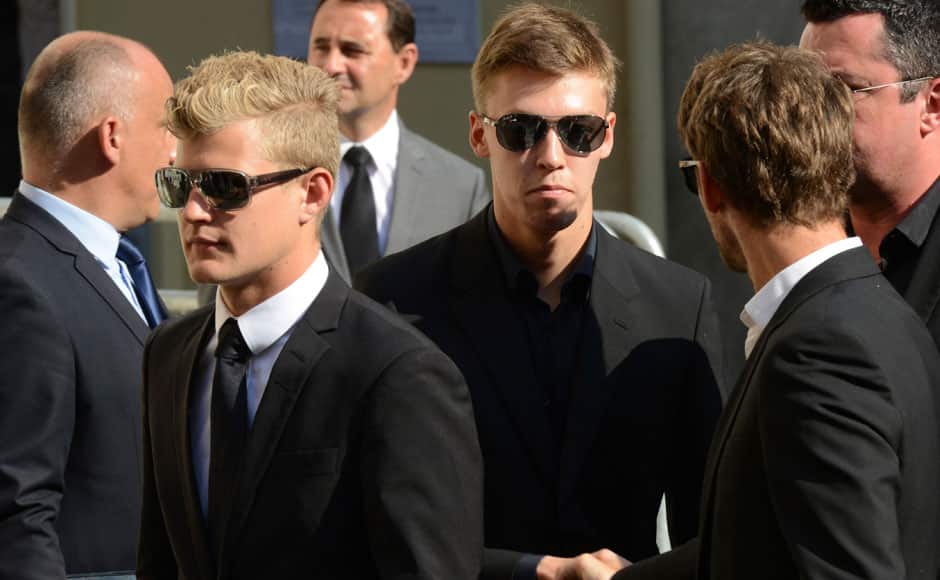 Formula One drivers Marcus Ericsson (L) and Daniil Kvyat (C) arrive to attend the funeral ceremony of late Marussia F1 driver Jules Bianchi at the Sainte Reparate Cathedral in Nice, France, July 21, 2015. Bianchi, 25, died in hospital in Nice on Friday, nine months after his crash at Suzuka in Japan and without regaining consciousness. REUTERS