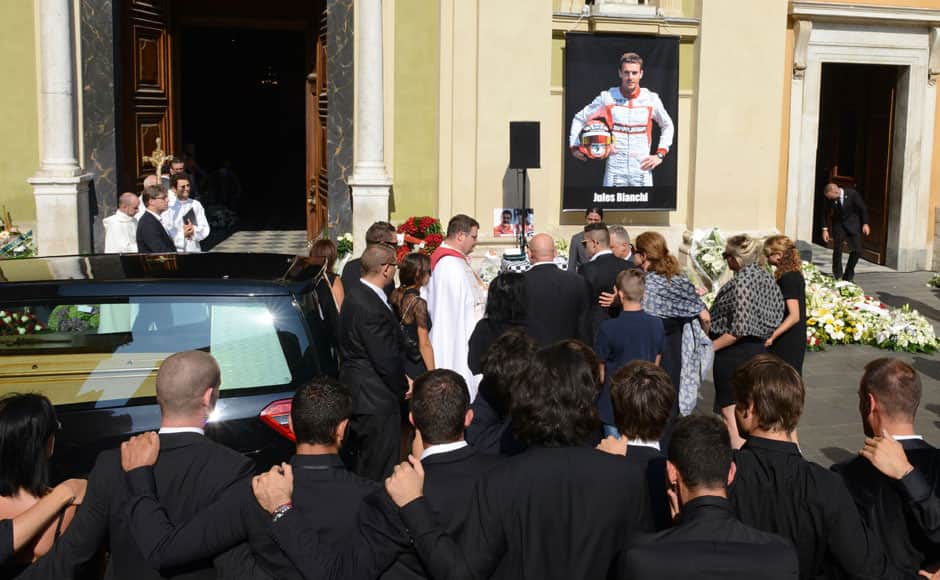 Friends and family stand close as they pray before the funeral ceremony for late Marussia Formula One driver Jules Bianchi at the Sainte Reparate Cathedral in Nice, July 21, 2015. Bianchi, 25, died in hospital in Nice on Friday, nine months after his crash at Suzuka in Japan and without regaining consciousness. REUTERS