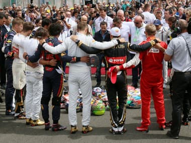 Forming a circle Formula One drivers embrace for a minute of silence to pay tribute to their recently deceased French colleague Jules Bianchi ahead the Hungarian Formula One Grand Prix. AFP