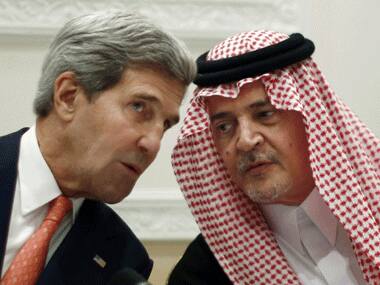 File photo. U.S. Secretary of State John Kerry, left, speaks with Saudi Arabia's Foreign Minister Prince Saud al-Faisal in Riyadh, Saudi Arabia. AP