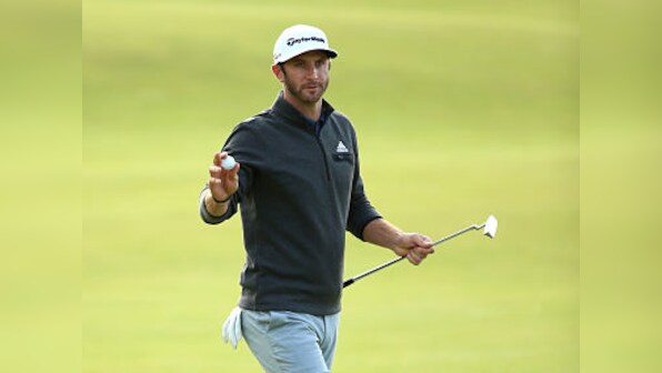 Golf: Johnson in halfway lead, Woeful Woods misses cut at weather-hit British Open