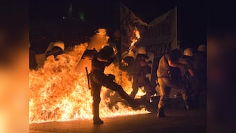 Austerity and Unrest: Greek protesters hurl petrol bombs at police