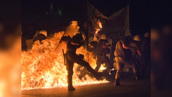 Austerity and Unrest: Greek protesters hurl petrol bombs at police