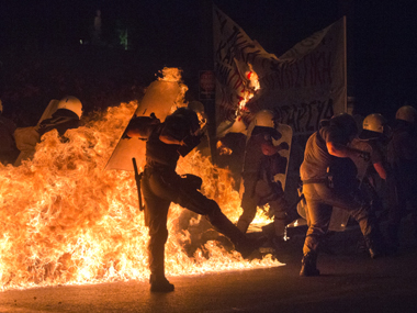 Austerity and Unrest: Greek protesters hurl petrol bombs at police Austerity and Unrest: Greek protesters hurl petrol bombs at police