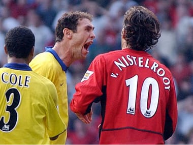 Martin Keown taunts Manchester United's Ruud Van Nistelrooy after he missed a penalty in dying seconds. An incident that is infamous in the clubs' folklore. AFP 