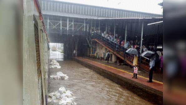 Heavy rains throws Mumbai out of gear with water logging, disruption of train services