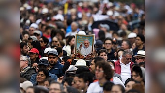Thousands line the streets of Ecuador for Pope Francis as he begins his South America tour