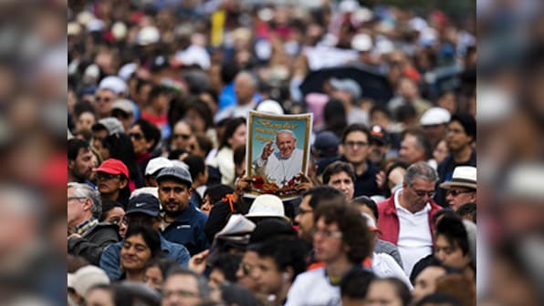 Thousands line the streets of Ecuador for Pope Francis as he begins his South America tour