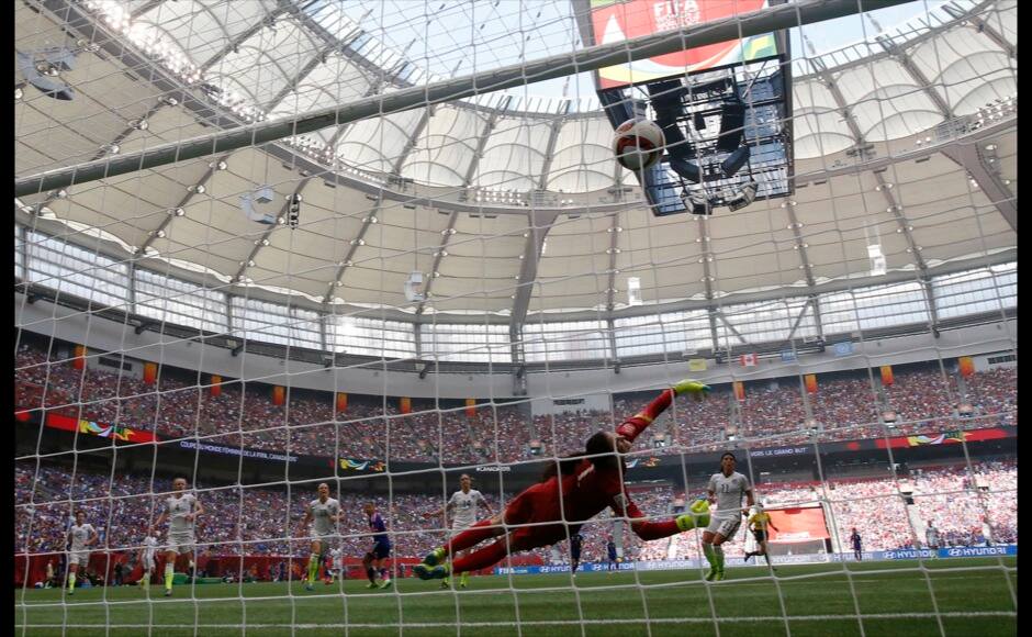 Jul 5, 2015; Vancouver, British Columbia, CAN; United States goalkeeper Hope Solo (1) gives up a goal to Japan forward Yuki Ogimi (17) during the first half of the final of the FIFA 2015 Women's World Cup at BC Place Stadium. Mandatory Credit: Michael Chow-USA TODAY Sports - RTX1J52V