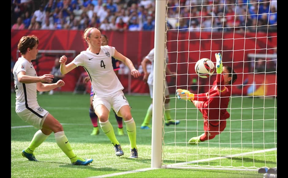 Jul 5, 2015; Vancouver, British Columbia, CAN; United States defender Meghan Klingenberg (22) and defender Becky Sauerbrunn (4) watch as goalkeeper Hope Solo (1) tries to stop an own goal by United States defender Julie Johnston against Japan in the second half of the final of the FIFA 2015 Women's World Cup at BC Place Stadium. Mandatory Credit: Anne-Marie Sorvin-USA TODAY Sports - RTX1J53W