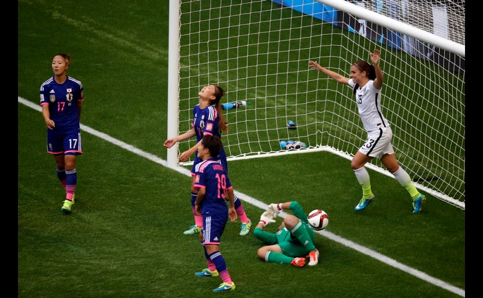 Jul 5, 2015; Vancouver, British Columbia, CAN; United States forward Alex Morgan (13) reacts after midfielder Tobin Heath (not pictured) scored against Japan goalkeeper Ayumi Kaihori (18) during the second half of the final of the FIFA 2015 Women's World Cup at BC Place Stadium. Mandatory Credit: Erich Schlegel-USA TODAY Sports - RTX1J54E