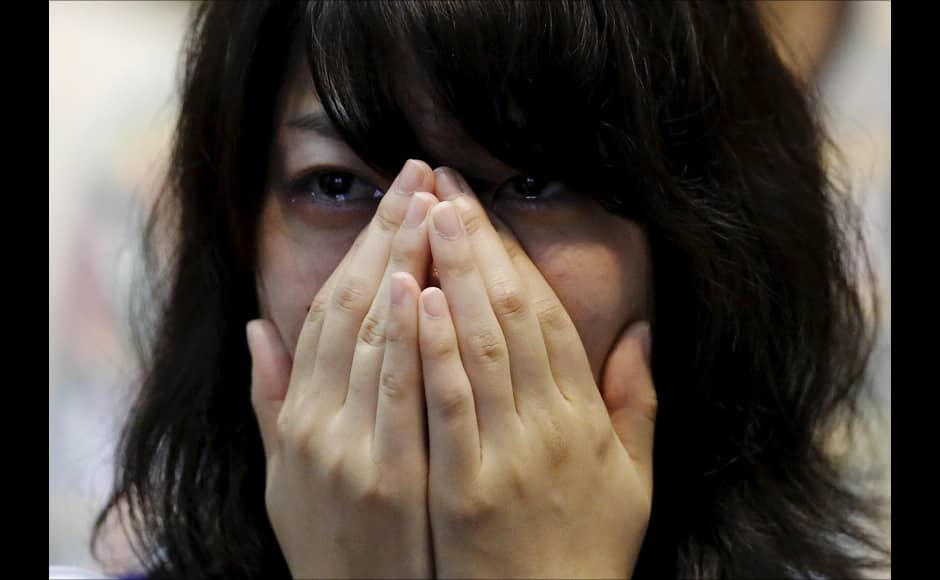 A Japan soccer fan cries after Japan lost their FIFA Women's World Cup final match against the U.S. in Vancouver, at a public viewing event in Tokyo, Japan, July 6, 2015. REUTERS/Toru Hanai - RTX1J58P