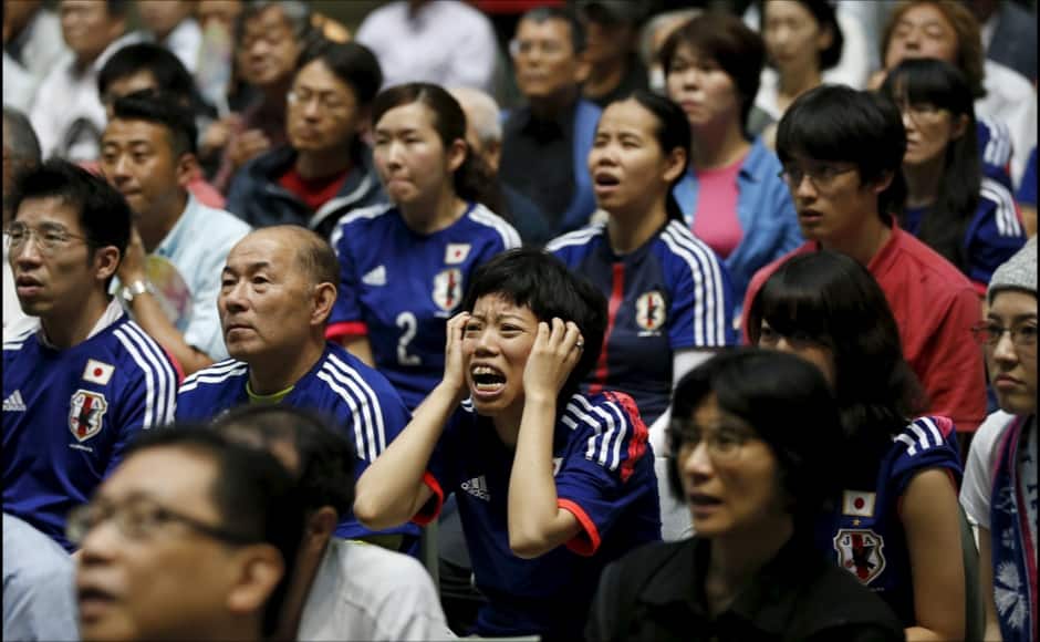 Japan soccer fans react as they watch Japan's FIFA Women's World Cup final match against the U.S. in Vancouver, at a public viewing event in Tokyo, Japan, July 6, 2015. Japan lost the match 5-2 to the U.S. REUTERS/Toru Hanai - RTX1J58W