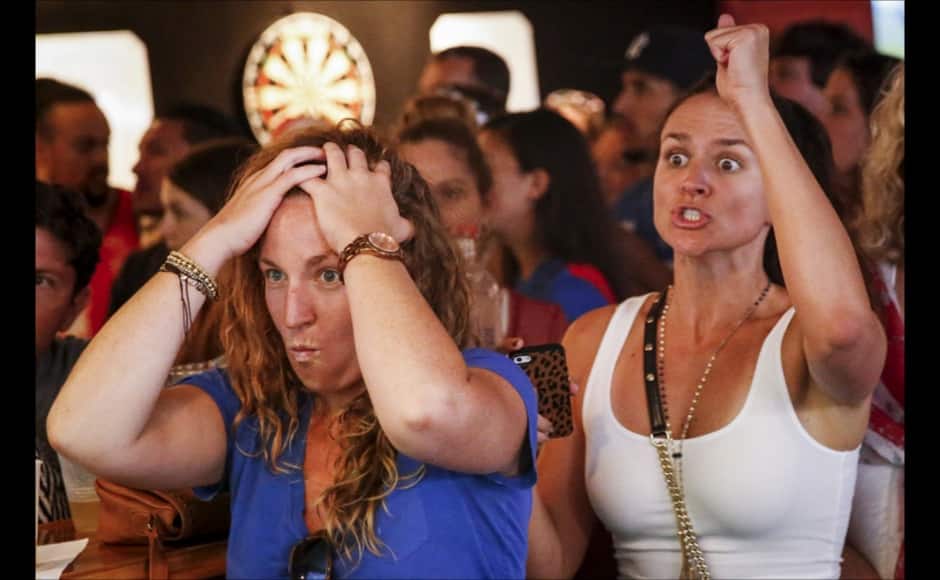 U.S. fans react as they watch the Women's World Cup final soccer match between USA and Japan, at the Underground Pub and Grill in Hermosa Beach, California July 5, 2015. The United States ushered in a new era of dominance with their Women's World Cup triumph over Japan on Sunday, a victory that will do plenty to bring an already passionate American interest in the sport to unprecedented levels. REUTERS/Patrick T. Fallon - RTX1J5E3