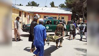 Suicide bomber kills 19, including women and children, in Afghan market