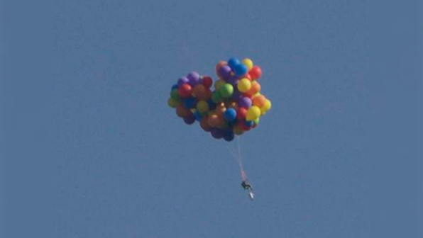 Up, up and away! Canadian man charged after flying in lawn chair attached to balloons