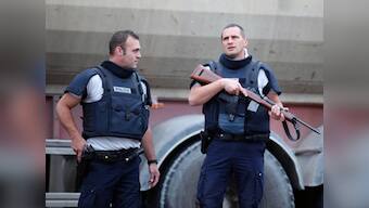 French police hunt for armed robbers after hostage crisis 