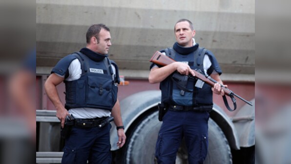 French police hunt for armed robbers after hostage crisis 