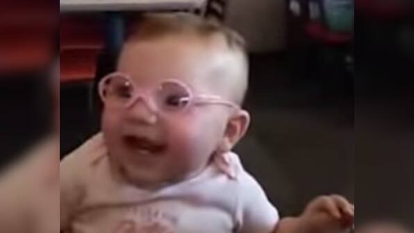 20-20 vision! Baby can't stop smiling after putting on new glasses