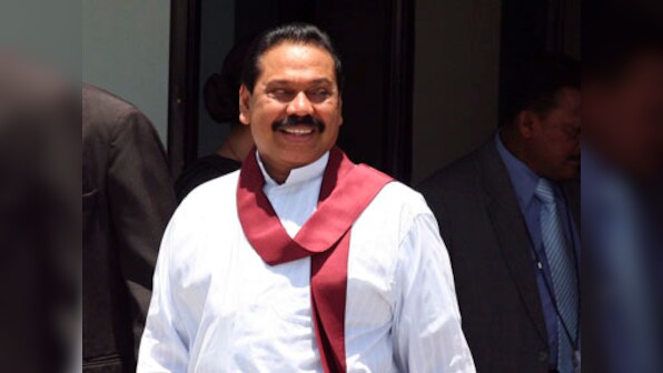 Flanked by handful of supporters, Rajapaksa says he'll enter poll fray to run for Sri Lanka parliament