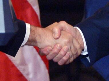 File photo. US Secretary of State John Kerry (R) and Cuba's Foreign Minister Bruno Rodriguez shake hands during a press conference at the State Department. AFP