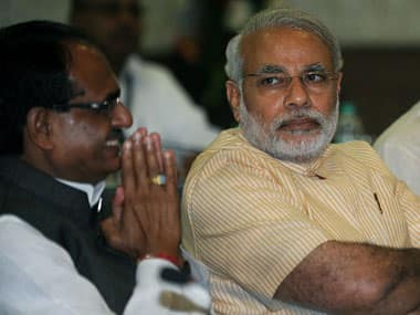 File photo of Shivraj Singh Chouhan with Narendra Modi. AFP
