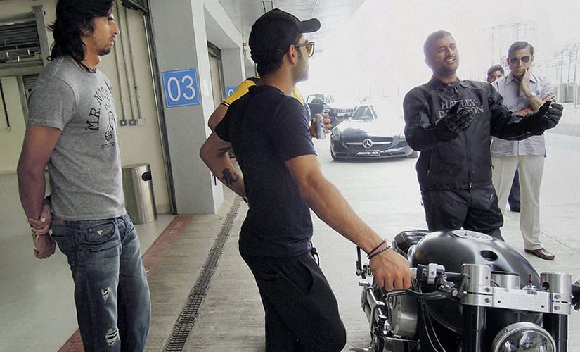 Dhoni with his bike at Buddh International Circuit. IBNLive 