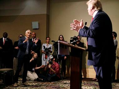Miami-based Univision anchor Jorge Ramos, left, asks Republican presidential candidate Donald Trump a question about his immigration proposal. AP