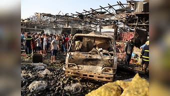 Truck bomb rips through Iraq food market, 54 killed