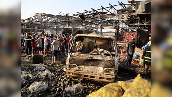 Truck bomb rips through Iraq food market, 54 killed