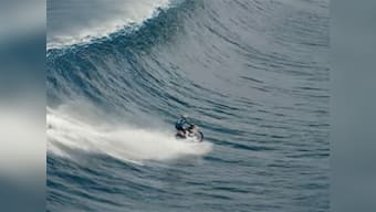 Must watch: Australian stuntman surfs massive wave on a motorbike