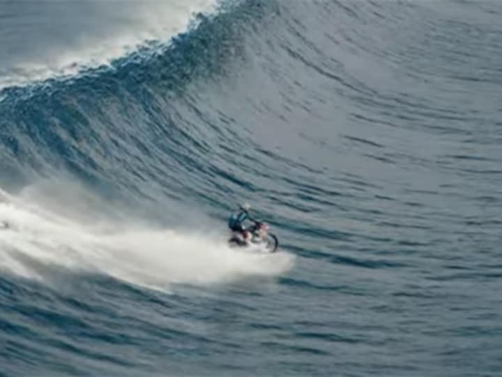 Must watch: Australian stuntman surfs massive wave on a motorbike