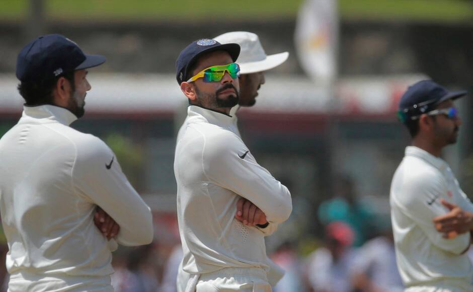 India's Virat Kohli looks on as he stands in the filed during the third day of the first cricket test match between India and Sri Lanka in Galle, Sri Lanka, Friday, Aug. 14, 2015. (AP Photo/Eranga Jayawardena)