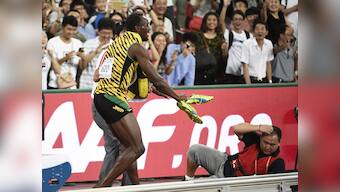 Gatlin paid him off: Watch Usain Bolt being brought down by a cameraman after stunning win