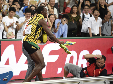 Gatlin paid him off: Watch Usain Bolt being brought down by a cameraman after stunning win Gatlin paid him off: Watch Usain Bolt being brought down by a cameraman after stunning win