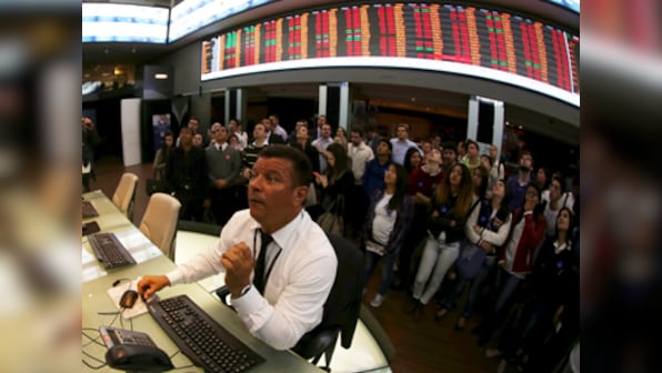 US stock futures jump in late trading following data on potential virus treatment, Trump guidelines