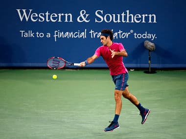 Roger Federer returns a shot to Roberto Bautista Agut of Spain during Day 4 of the Western & Southern Open. Getty