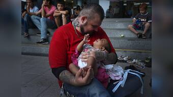 Meet Baba Mujhse, a 'gentle giant' who leads volunteers helping migrants in Hungary 