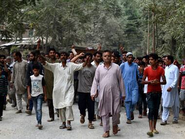 Protesters in the funeral procession of a youth allegedly killed in BSF firing. AFP.