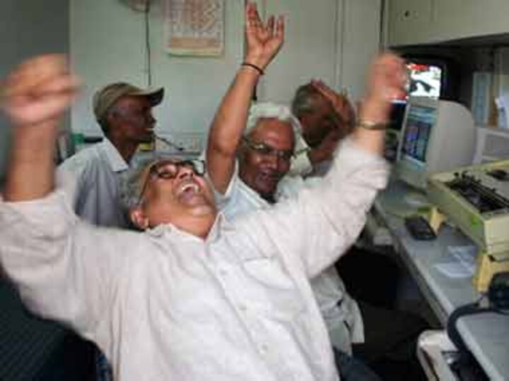 Sensex ends at two-week high, surges 517 points on global rally