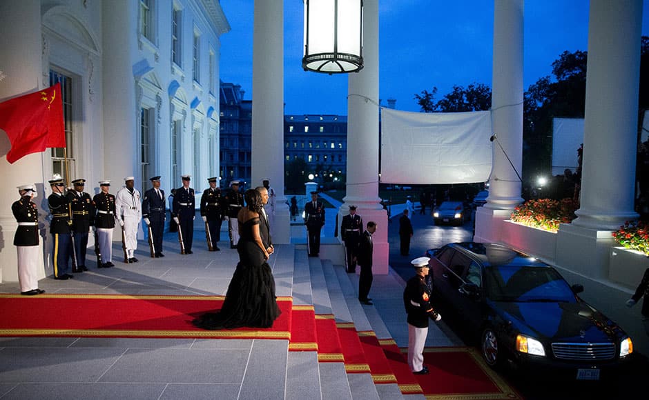 President Barack Obama and first lady Michelle Obama greet Chinese President Xi Jinping and his wife Peng Liyuan as they arrive for a State Dinner, Friday, Sept. 25, 2015, on the North Portico of the White House in Washington. AP