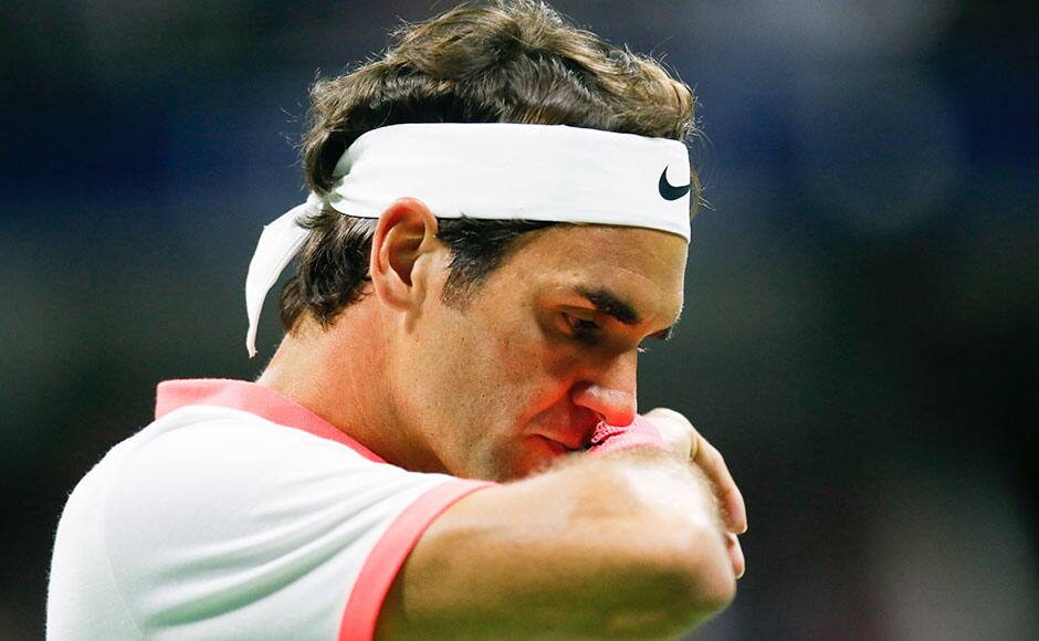 Roger Federer of Switzerland reacts between points against Novak Djokovic of Serbia during their men's singles final match at the U.S. Open Championships tennis tournament in New York, September 13, 2015. REUTERS
