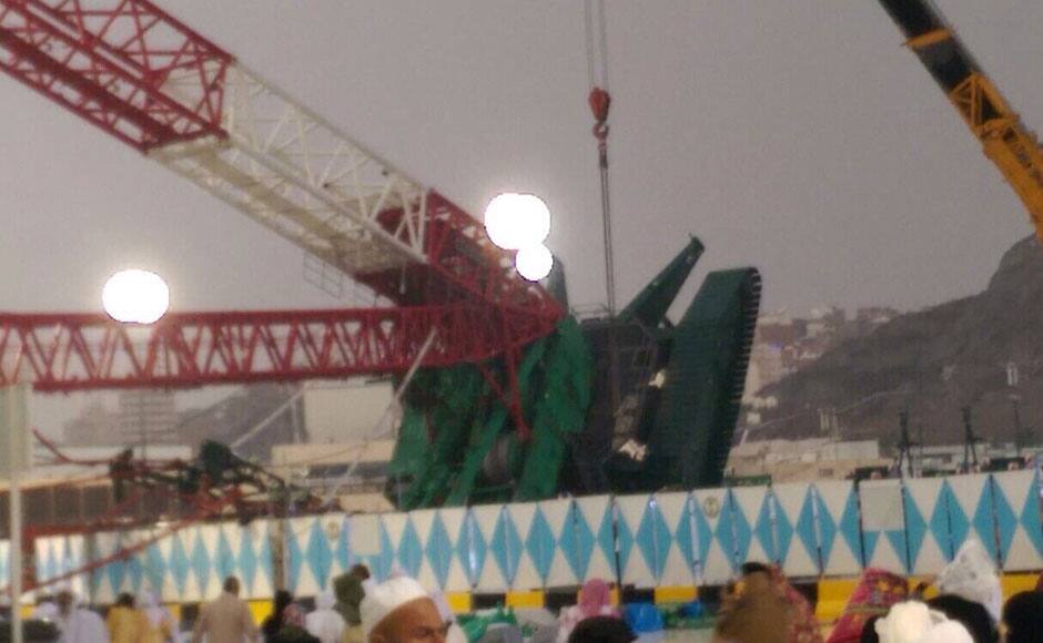 Pilgrims and first responders gather at the site of a crane collapse that killed dozens inside the Grand Mosque in Mecca, Saudi Arabia, Friday, Sept. 11, 2015. The accident happened as pilgrims from around the world converged on the city, Islam's holiest site, for the annual Hajj pilgrimage, which takes place this month. (AP Photo)